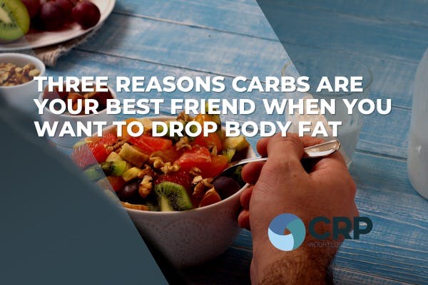 Photo of a bowl of food being eaten with the caption "three reasons carbs are your best friend when you want to drop body fat"